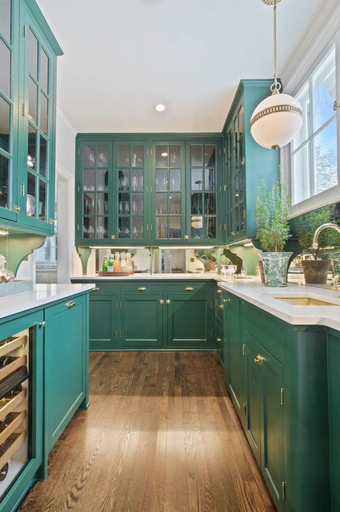 teal cabinets in kitchen with chrome accents