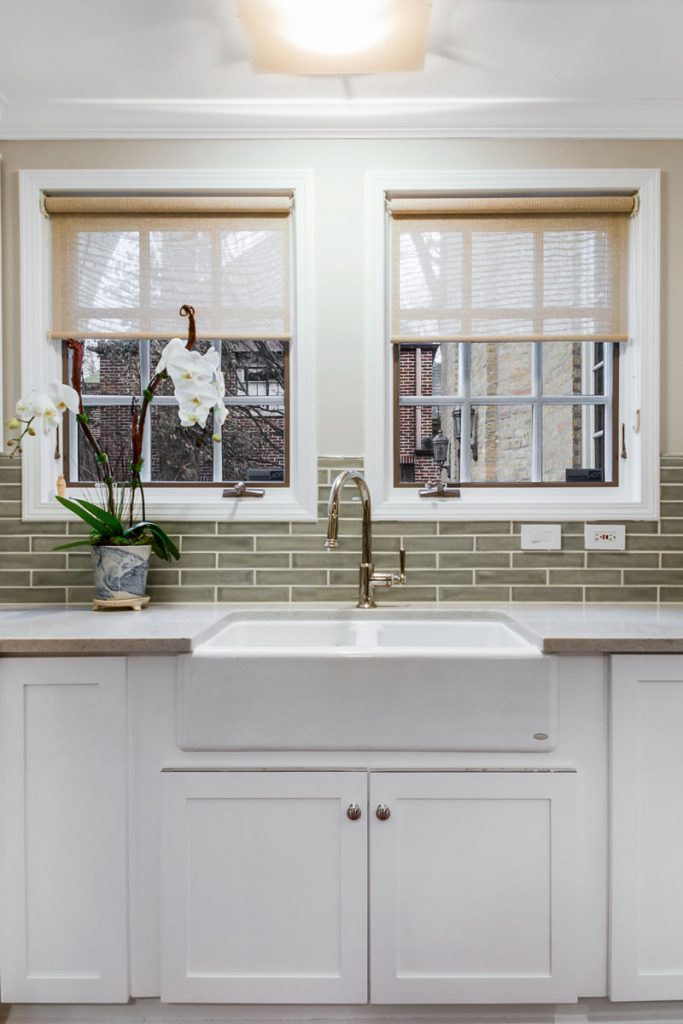 white kitchen with greenish grey backsplash tile