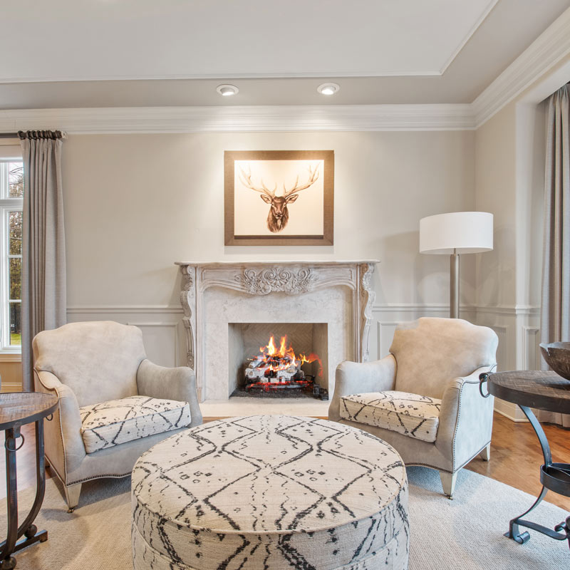 living room with custom made fireplace with decorative furniture