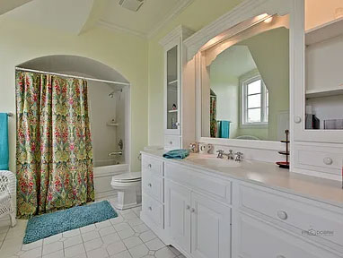 before bathroom renvoation- light green walls, shower and bathtub combo